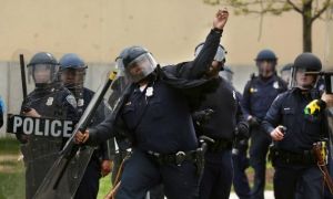 Cop Throws Rocks At Baltimore Protestors