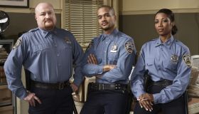 Three police officers in office, portrait