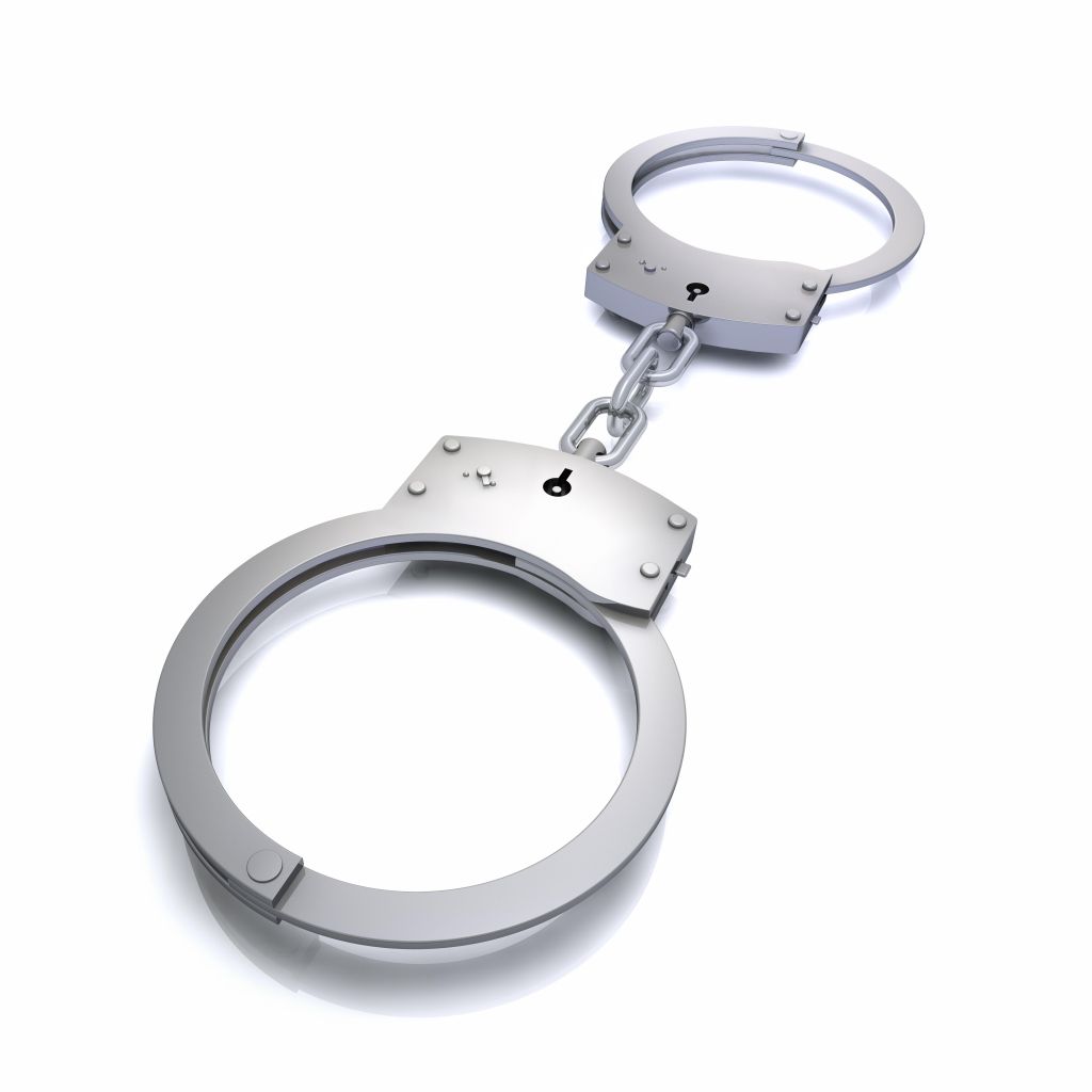 Locked Handcuffs on white background